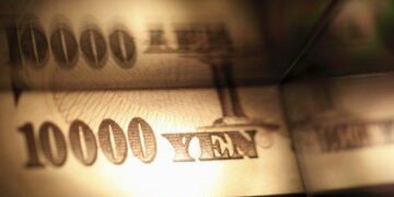 BOJ keeps rates steady, cuts growth forecasts on US tariffs hit