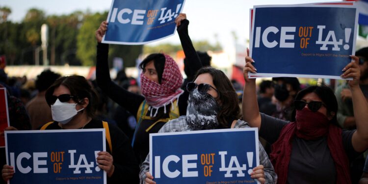 Riot police, anti-ICE protesters square off in Los Angeles after raids