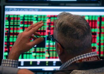 Dow sinks more than 850 points as tariff uncertainty and AI disruption fears roil markets