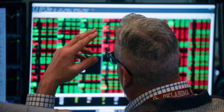 Dow sinks more than 850 points as tariff uncertainty and AI disruption fears roil markets