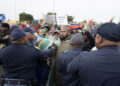 Heavy police presence keeps a lid on anti-immigrant violence