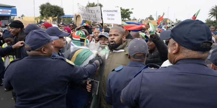 Heavy police presence keeps a lid on anti-immigrant violence