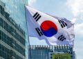 KOSPI Surge Triggers Curbs, SK Hynix Soars 9% Leading Chip Stocks, Samsung and Kioxia Gain
